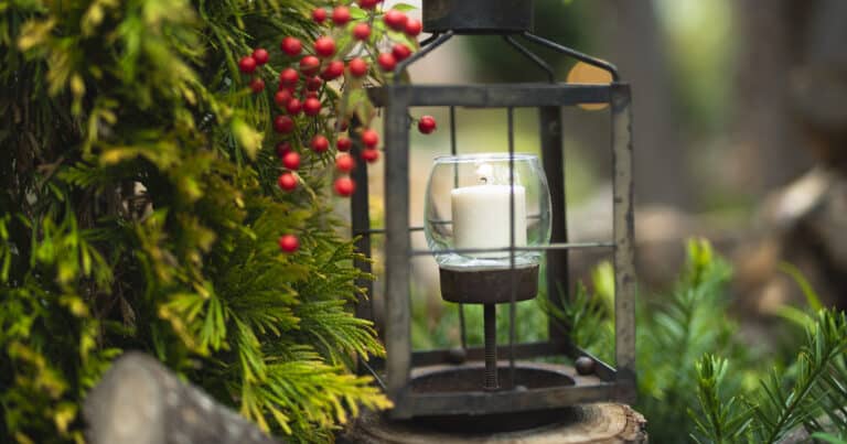 Rustic candle holder with fall foliage, branches, and berries
