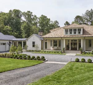 The front arrival court or parking area of the Southern Living Idea House with surrounding plants