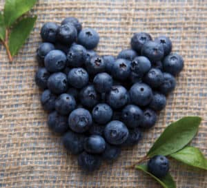 Southern Living blueberries arranged in heart shape on burlap material