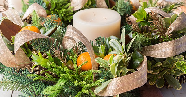 Wreath of evergreen limbs with a center candle