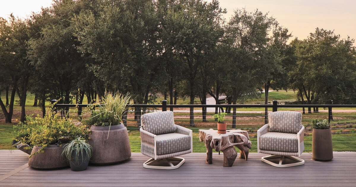 Container plantings bring foliage and texture to the front porch of the Southern Living Idea House