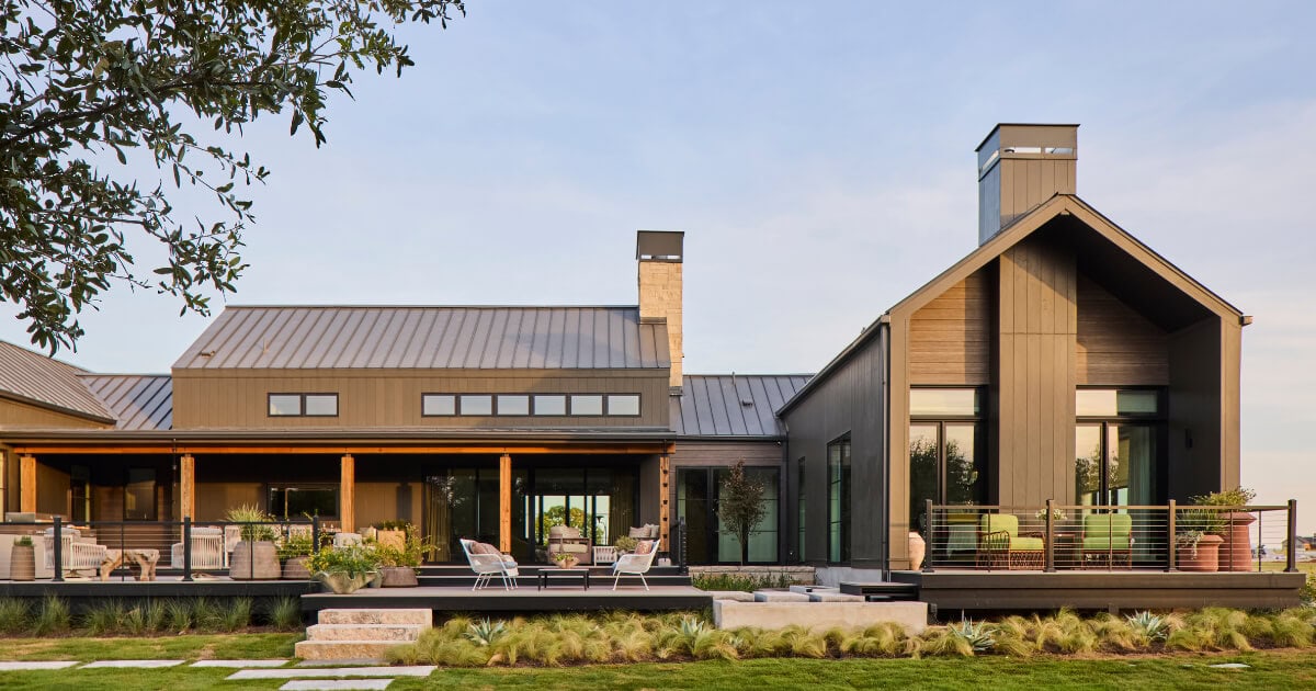 Rear view of the 2026 Southern Living Idea House and its surrounding landscape